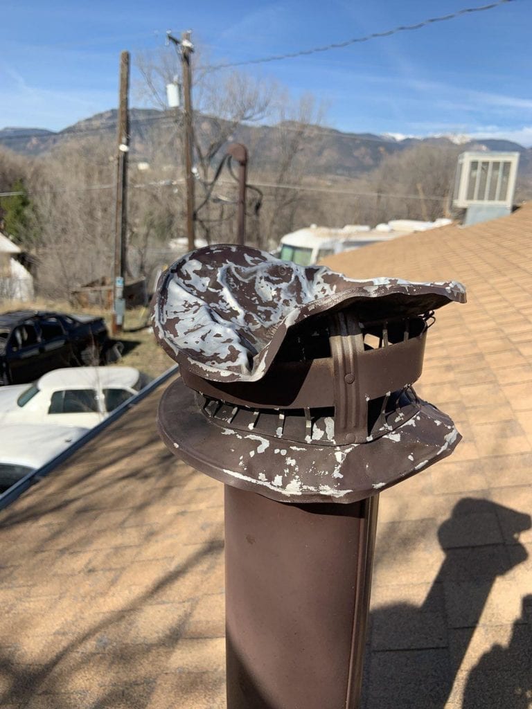 Roof vent damaged by hail storm