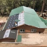 New green metal roofing installation in Evergreen CO by New Roof Plus