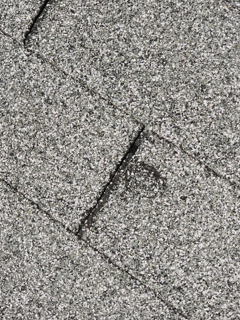 Image of hail damage on a roof